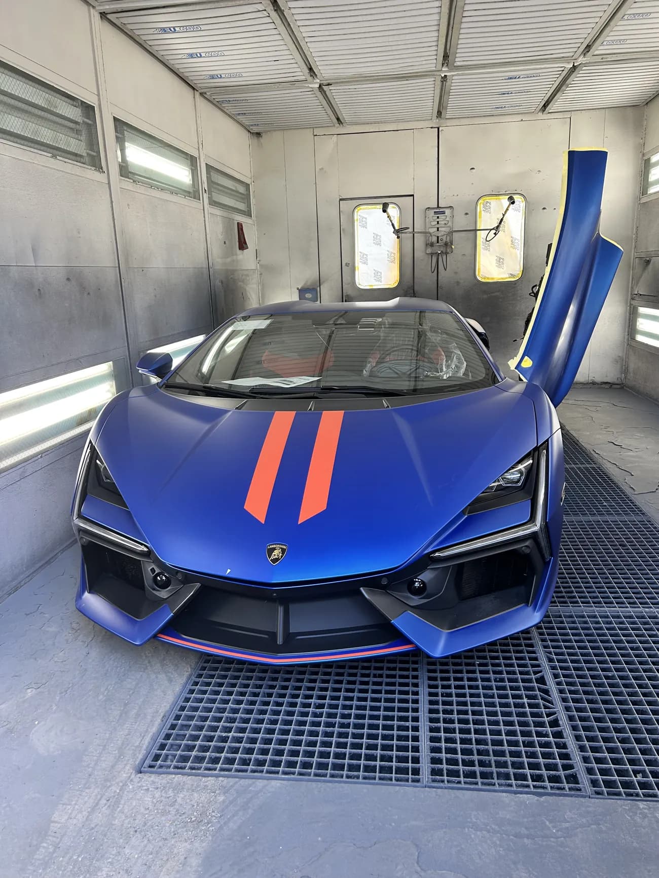 Vehicle front masked in the booth.