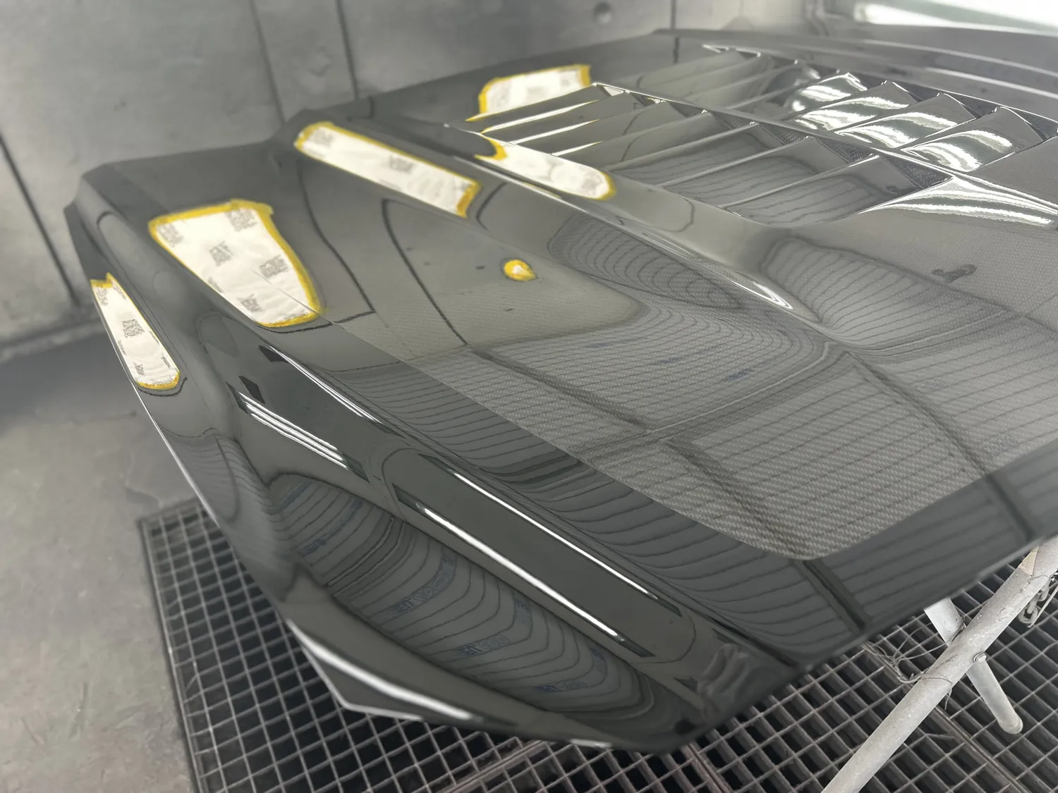 Carbon panel being refinished in the booth.