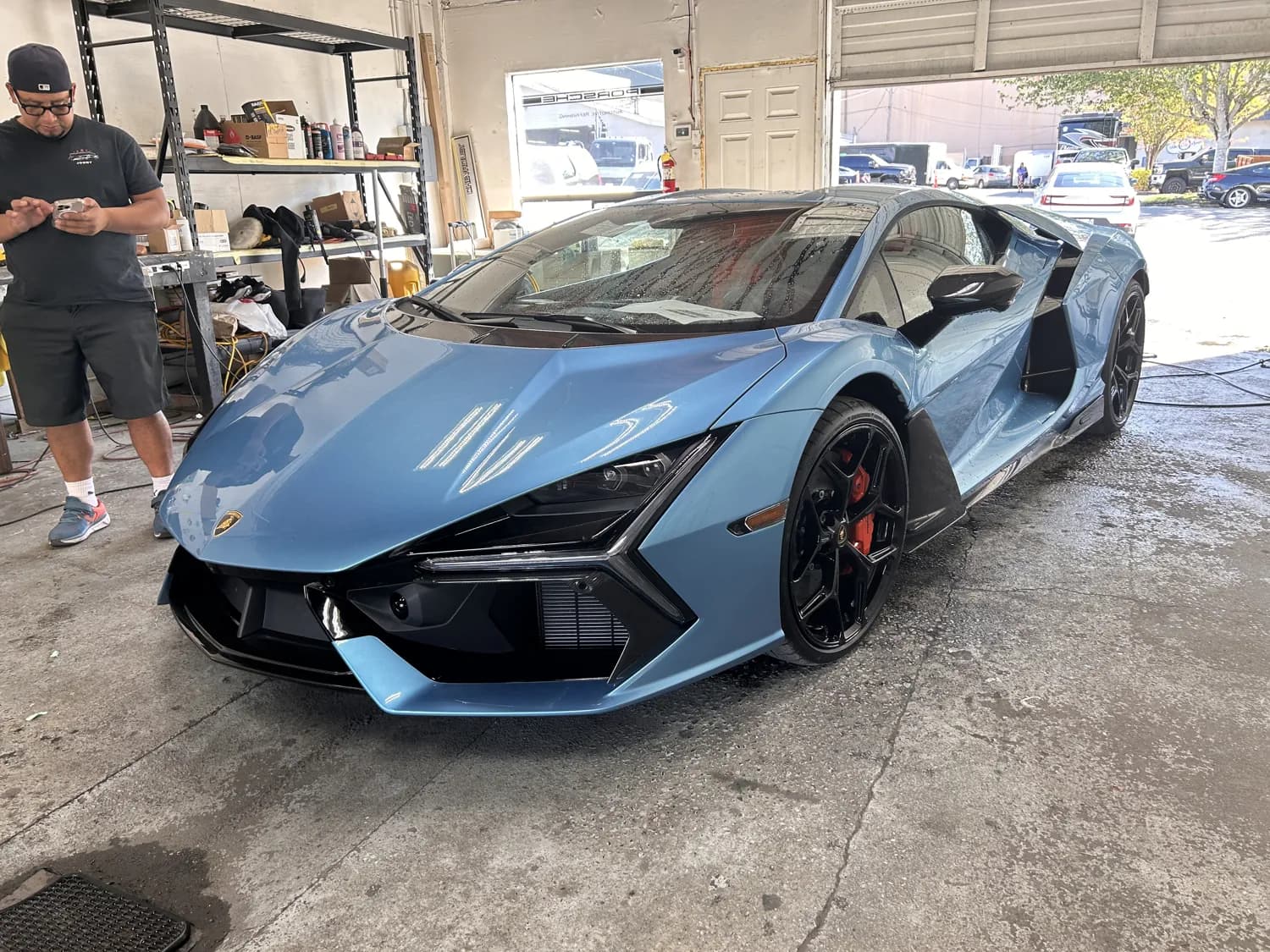 Teal Lamborghini profile in the shop.