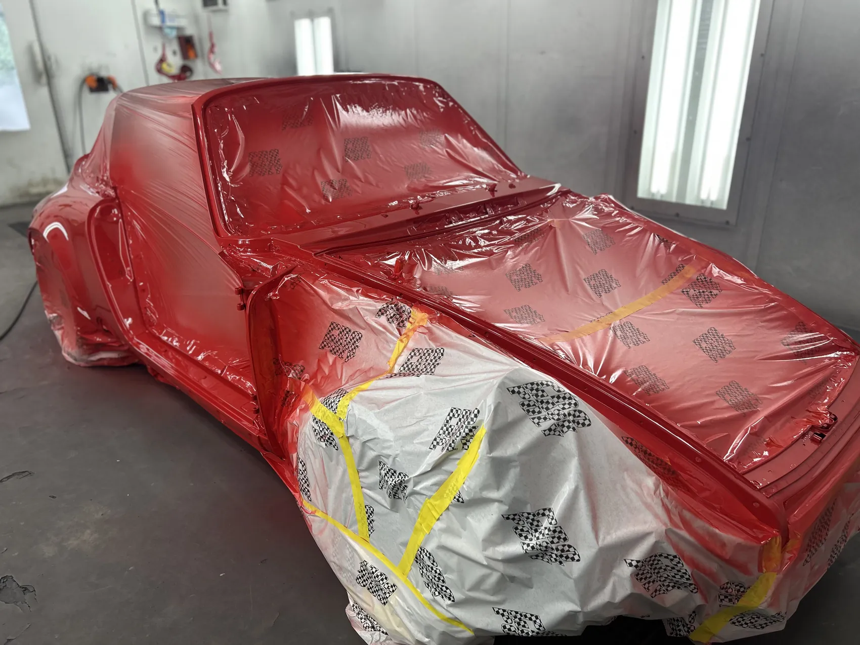 Classic Porsche 911 refinished in deep gloss red.