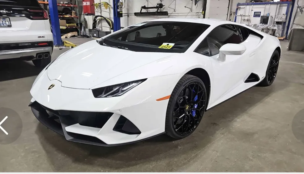 White Lamborghini Revuelto profile.